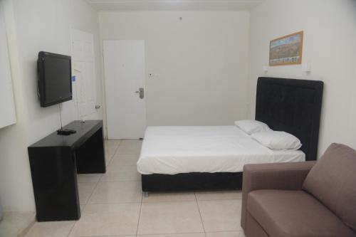 TV a/nebo společenská místnost v ubytování Hotel Maman
