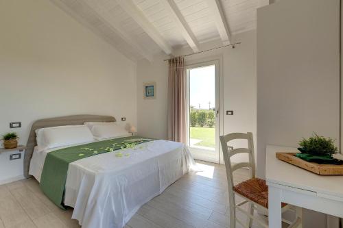 Ένα ή περισσότερα κρεβάτια σε δωμάτιο στο Agriturismo Il Lentisco