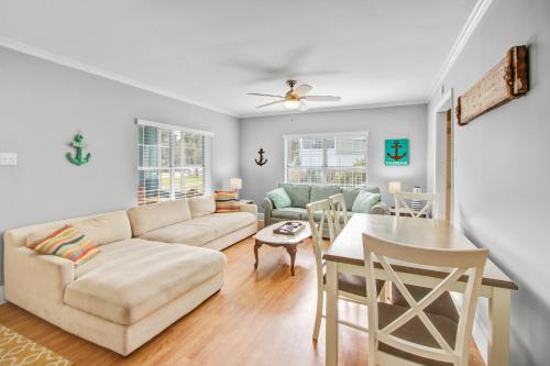 a living room with a couch and a table at Palm Boulevard 2403 - Downstairs in Isle of Palms