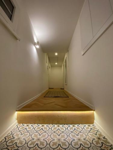 a room with a bed in the middle of a room at West Studio Apartment Sarajevo in Sarajevo