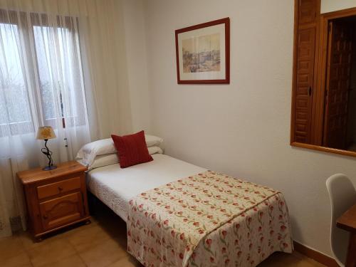 Katil atau katil-katil dalam bilik di Hostal El Panadero