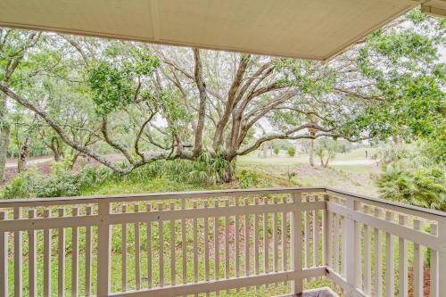 a porch with a wooden fence and trees at Fairway Dunes 3 in Isle of Palms