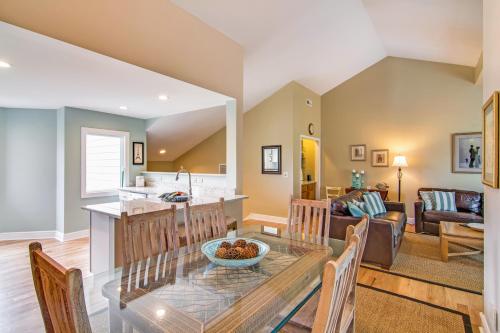 a kitchen and living room with a glass table and chairs at Fairway Dunes 3 in Isle of Palms