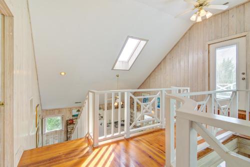 a white staircase in a home with a skylight at Flag Street 1851 A in Sullivans Island