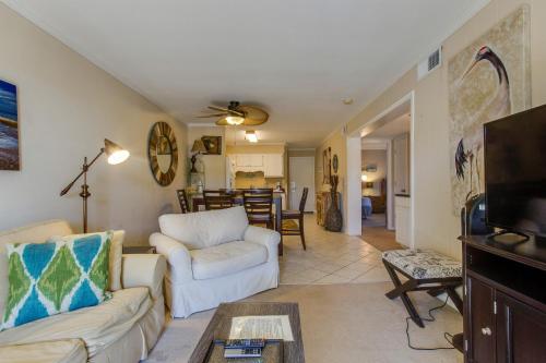 a living room with two couches and a tv at Oceanside 301-A in Isle of Palms