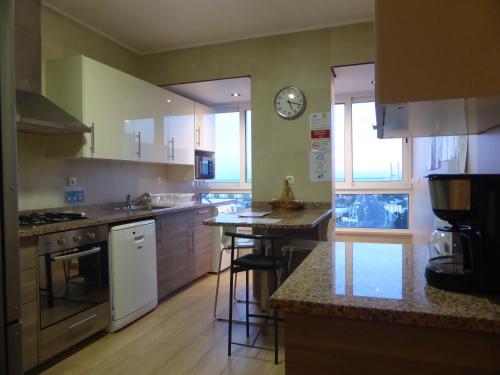 a kitchen with a sink and a counter top at A View to the River Tejo by SixtyFive Boutique Home in Lisbon