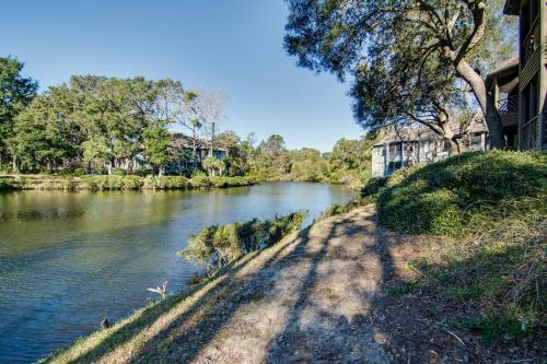a river with a building next to a river at Turtle Cove 5546 in Kiawah Island