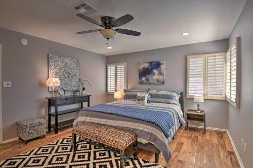 a bedroom with a bed and a ceiling fan at Scottsdale Home with Pool, Yard, Hammock and Fire Pit! in Scottsdale