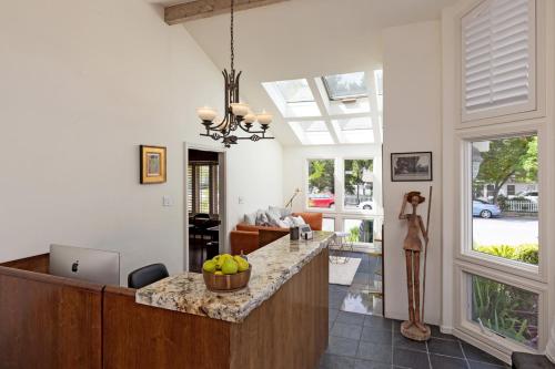 a kitchen with a counter with a bowl of fruit on it at Saratoga Oaks Lodge in Saratoga