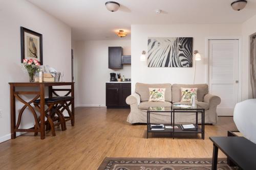 a living room with a couch and a table at Hotel Flora and Fauna in Wimberley