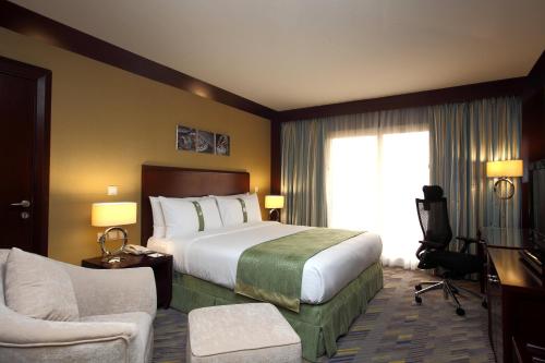 En eller flere senger på et rom på Holiday Inn Al Khobar - Corniche, an IHG Hotel