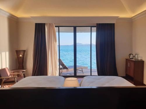a hotel room with a view of the ocean at Sea Star Resort Semporna in Semporna