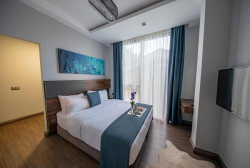 Postel nebo postele na pokoji v ubytování Peerless Villas Hotel