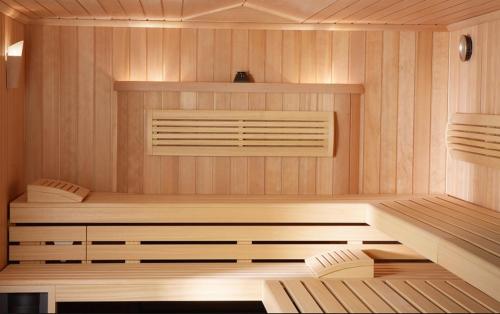 a sauna with a wooden floor and a saunavisor at Landhaus Notburga in Gries im Sellrain
