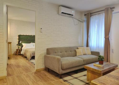 a living room with a couch and a bedroom at Ananya Apartments Phase 2 in Kathmandu