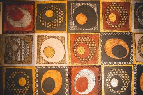 a close up of a tile wall with a pattern at Base Hotel in Noventa di Piave