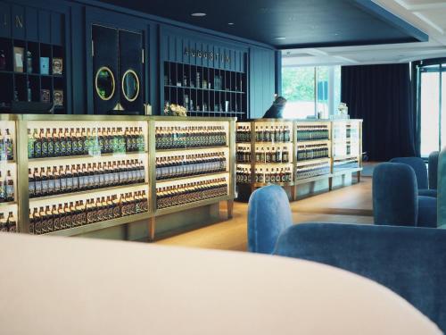 a tasting room with bottles of wine on display at Jugend- und Familienhotel Augustin in Munich