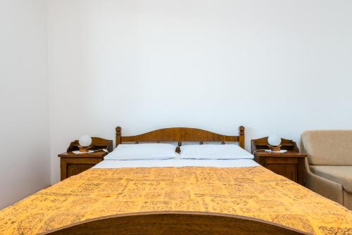 Postel nebo postele na pokoji v ubytování Villa Kukuljica