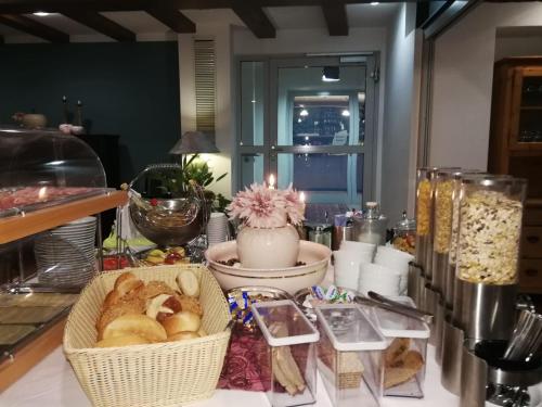 a table with baskets of bread and other items at Hotel Restaurant Rössle in Calw
