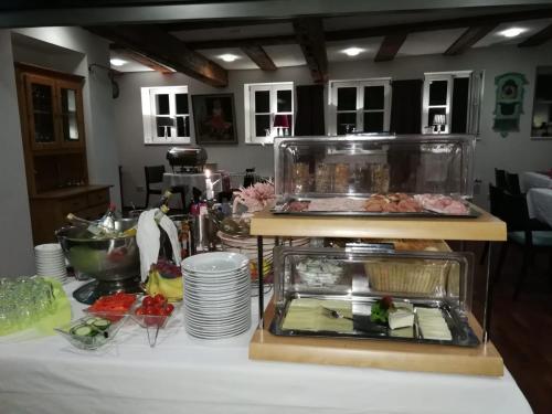 a table with a buffet with food on it at Hotel Restaurant Rössle in Calw