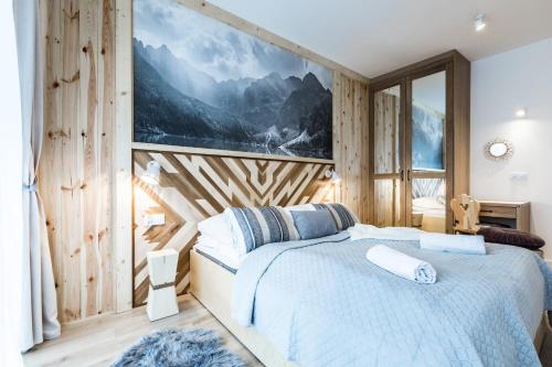 Posteľ alebo postele v izbe v ubytovaní Apartamenty Royal Resort Spa