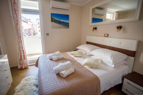 Posteľ alebo postele v izbe v ubytovaní Apartment Centrum