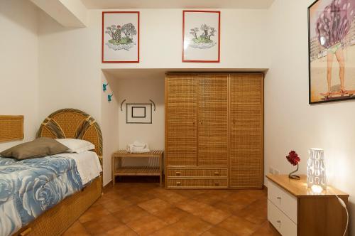 Ένα ή περισσότερα κρεβάτια σε δωμάτιο στο Casa Vacanze Calipso