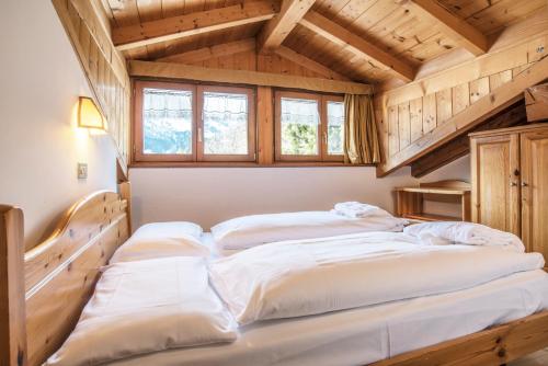 Un pat sau paturi într-o cameră la Relais Clubresidence