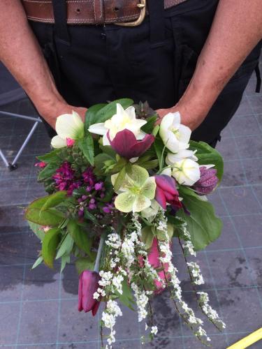 a man in uniform holding a bouquet of flowers at Stensholms Trädgård in Nässjö