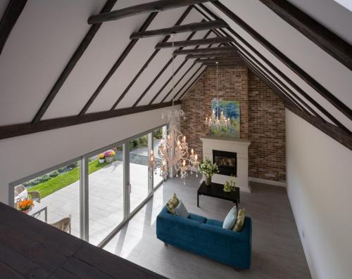 an overhead view of a living room with a blue couch at LEA Barn in Żagań