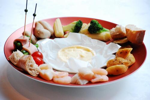 a red plate of food with eggs and vegetables at Hotel Trusty Tokyo Bayside in Tokyo