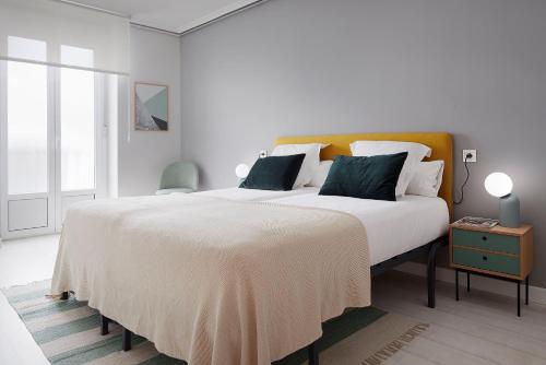 מיטה או מיטות בחדר ב-Colón by FeelFree Rentals