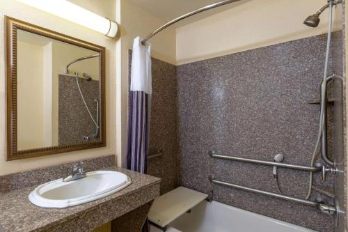 a bathroom with a sink and a shower at La Quinta by Wyndham Dodge City in Dodge City