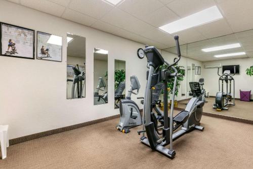 a gym with treadmills and ellipticals in a room at Sleep Inn & Suites near Sports World Blvd in Gatlinburg
