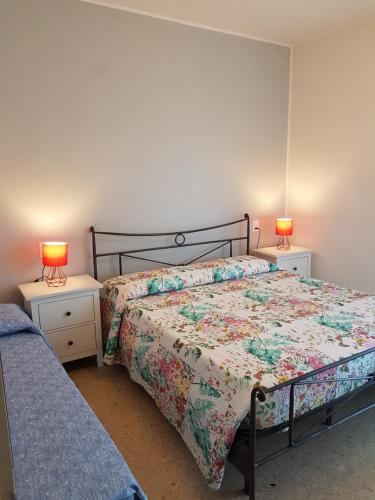 Postel nebo postele na pokoji v ubytování Casa Adua appartamento