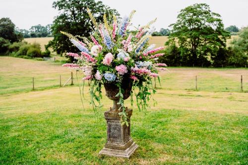 a bouquet of flowers sitting on top of a field at Slapton Manor in Towcester