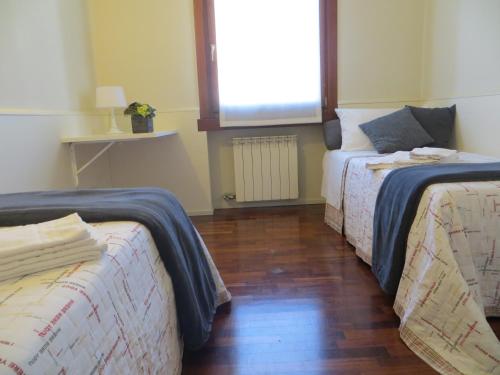 Ein Bett oder Betten in einem Zimmer der Unterkunft Tricamere in Soave