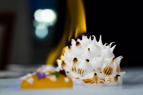 a dessert with white whipped cream on top of it at Fishmore Hall Hotel and Boutique Spa in Ludlow