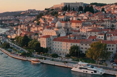 a view of a city with boats in the water at Apartmani Krnić in Šibenik