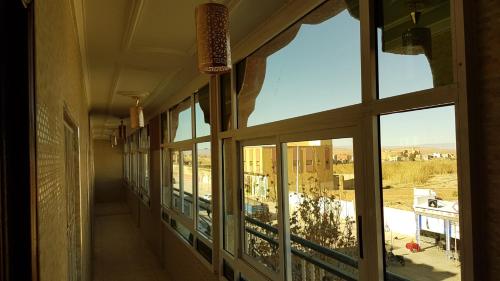 a room with a window with a view of a city at Hotel Nice 06 in Midelt