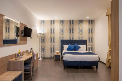 Posteľ alebo postele v izbe v ubytovaní Domus Porto Di Traiano Resort