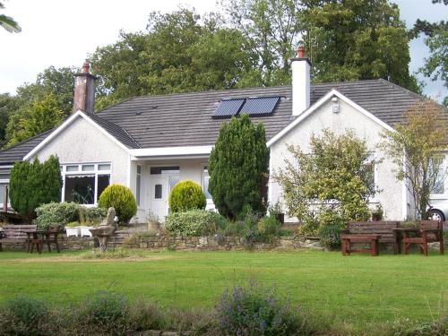 a house with a solar panel on the roof at Launard House in Kilkenny