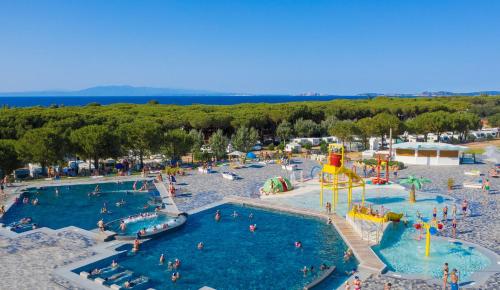 an aerial view of a pool at a water park at Camping Village Baia Blu La Tortuga in Aglientu