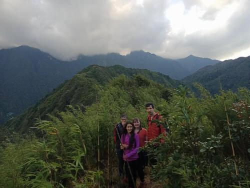 a group of people standing on top of a mountain at ChienDe Homestay in Sa Pa