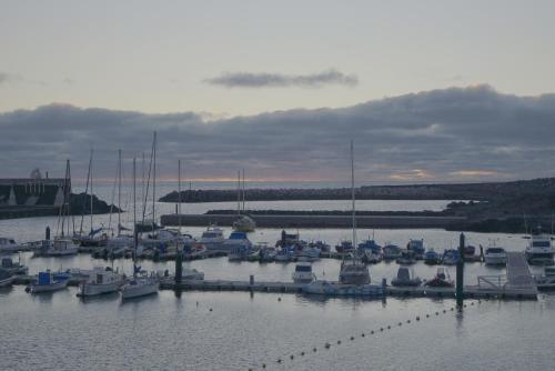 a bunch of boats docked in a harbor at Sur Restinga in La Restinga