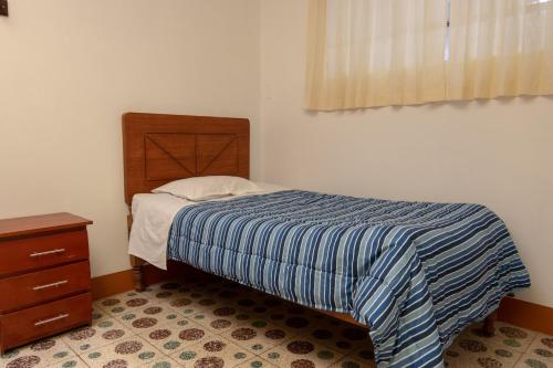 Llit o llits en una habitació de Hostal Roma