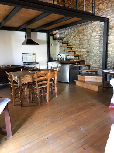 a dining room with a table and wooden chairs at Il Pezzatino in Rufina