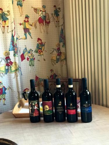 a group of four bottles of wine sitting on a table at Il Pezzatino in Rufina