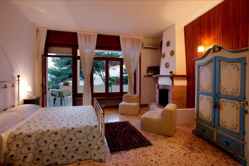 En eller flere senger på et rom på Hotel Il Vascello