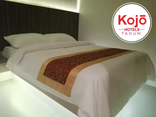En eller flere senge i et værelse på Kojõ Hotel Tagum